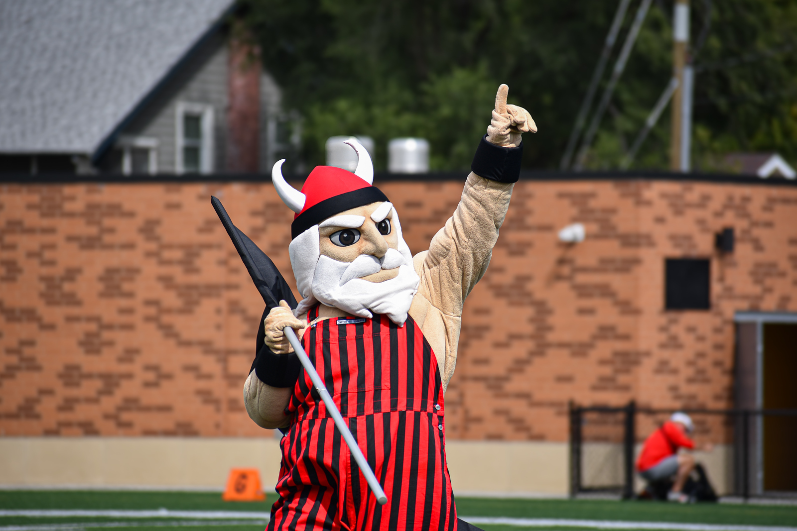 Viktor the Viking Viktor the Viking pointing number 1 while holding a flag at a Vikings athletics event